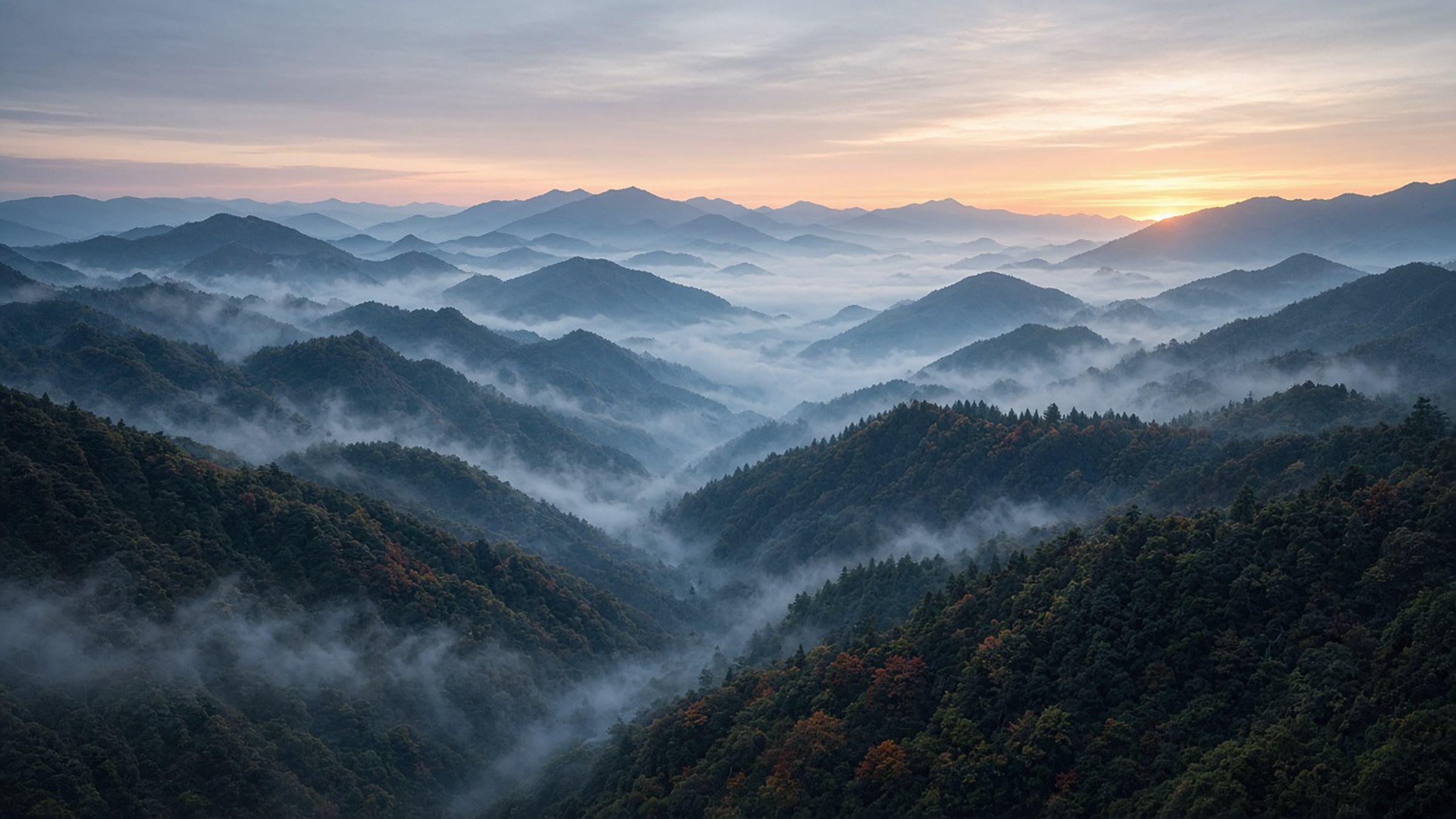 Misty mountain ridges at dawn